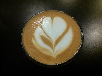 Coffee cup with foam like a flower